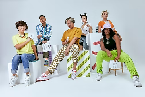 Glass Lizzard cast of six models in bright streetwear holding skincare products on white blocks