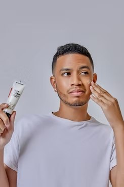 Glass Lizzard model with skincare product in hand